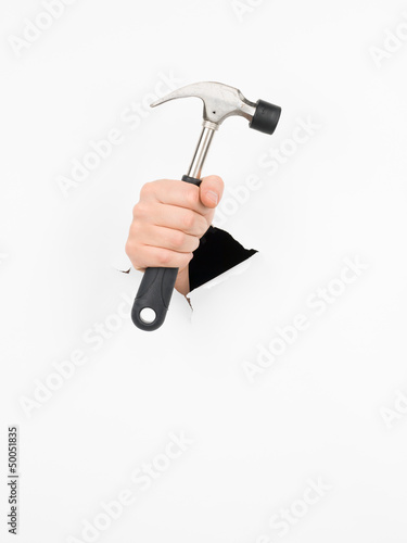 male hand holding hammer