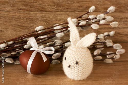 Easter egg and rabbit on catkins background