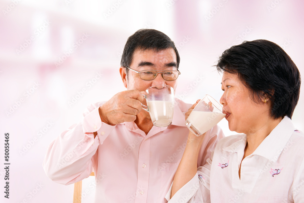 Asian mature couple drinking soy milk Asian mature couple drinking soy milk