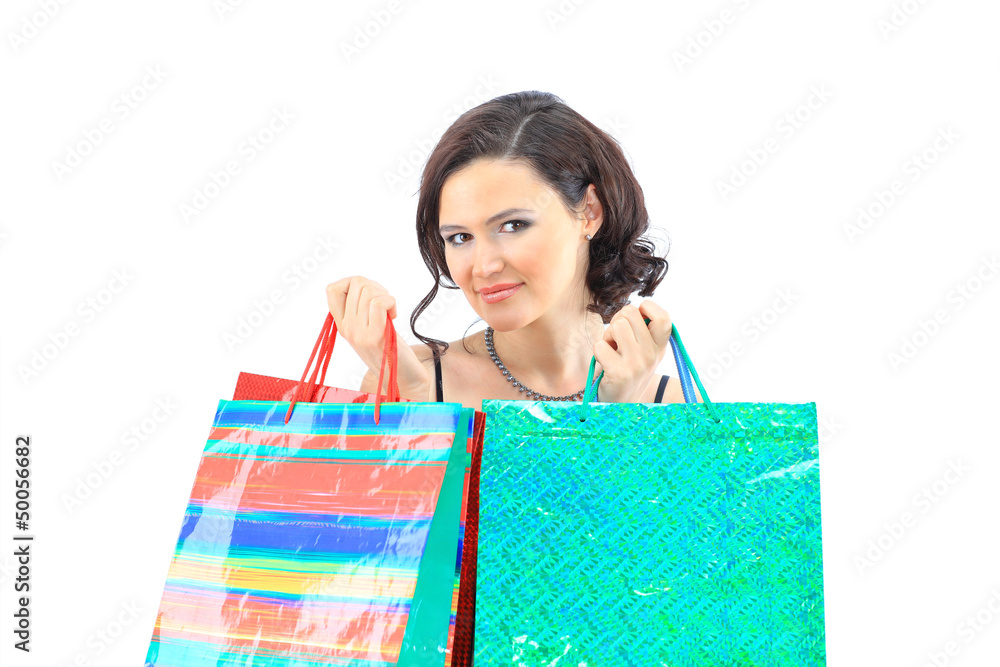 Happy young adult girl, with color-coded bags. Happy young adult girl, with color-coded bags.