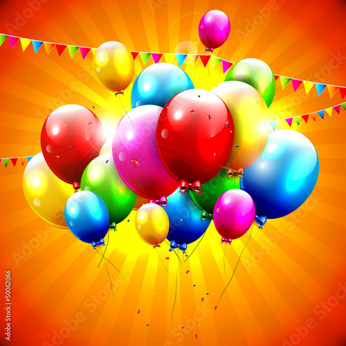 Flying colorful balloons on orange background