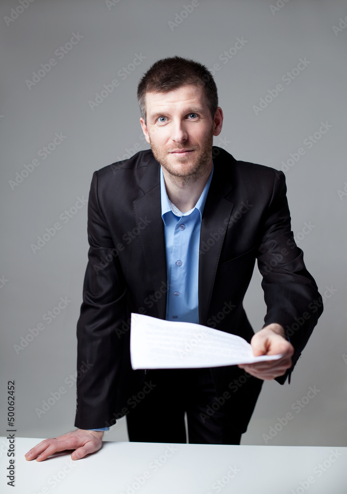 Businessman giving a contract Businessman giving a contract