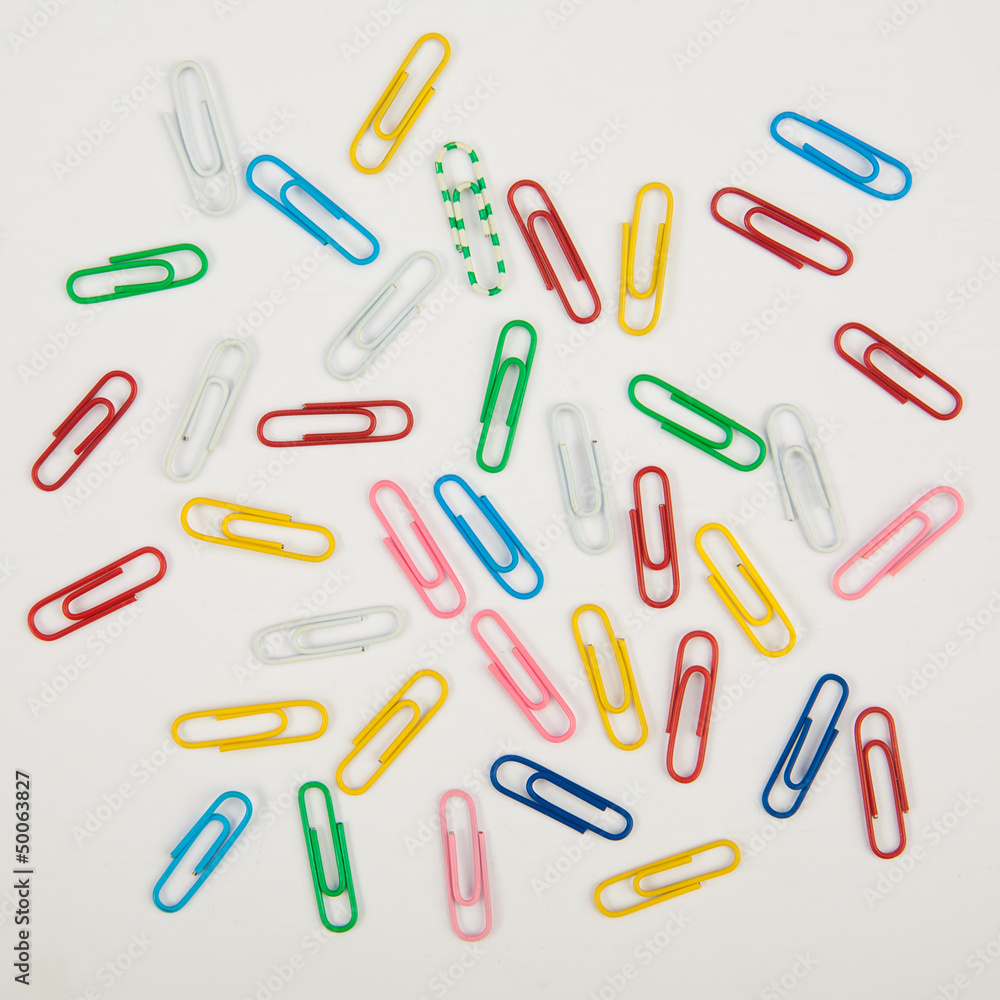 Paper clips on a white background. Closeup Paper clips on a white background. Closeup