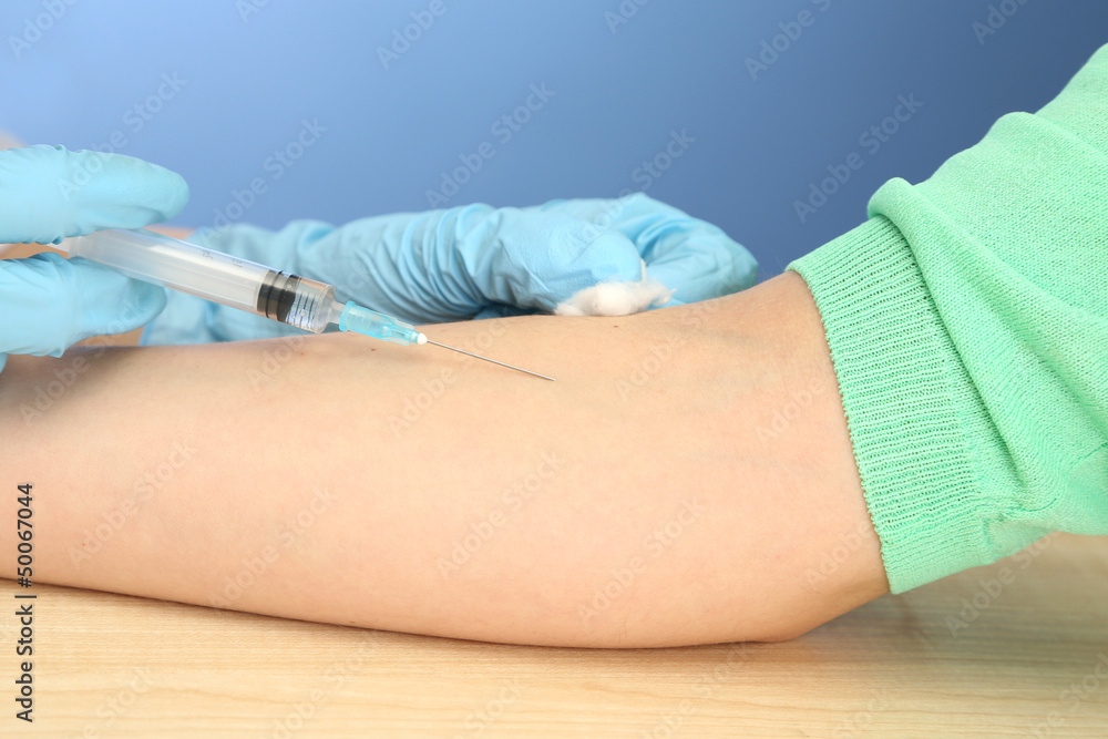 Doctor holding syringe with a vaccine in the patient hand, Doctor holding syringe with a vaccine in the patient hand,