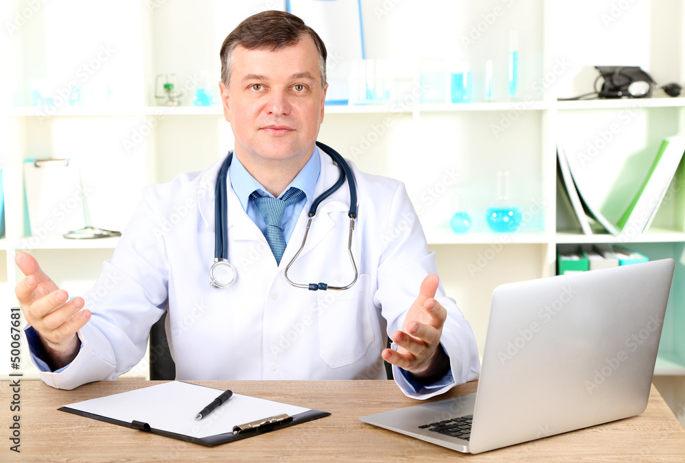 Medical doctor working at desk Medical doctor working at desk