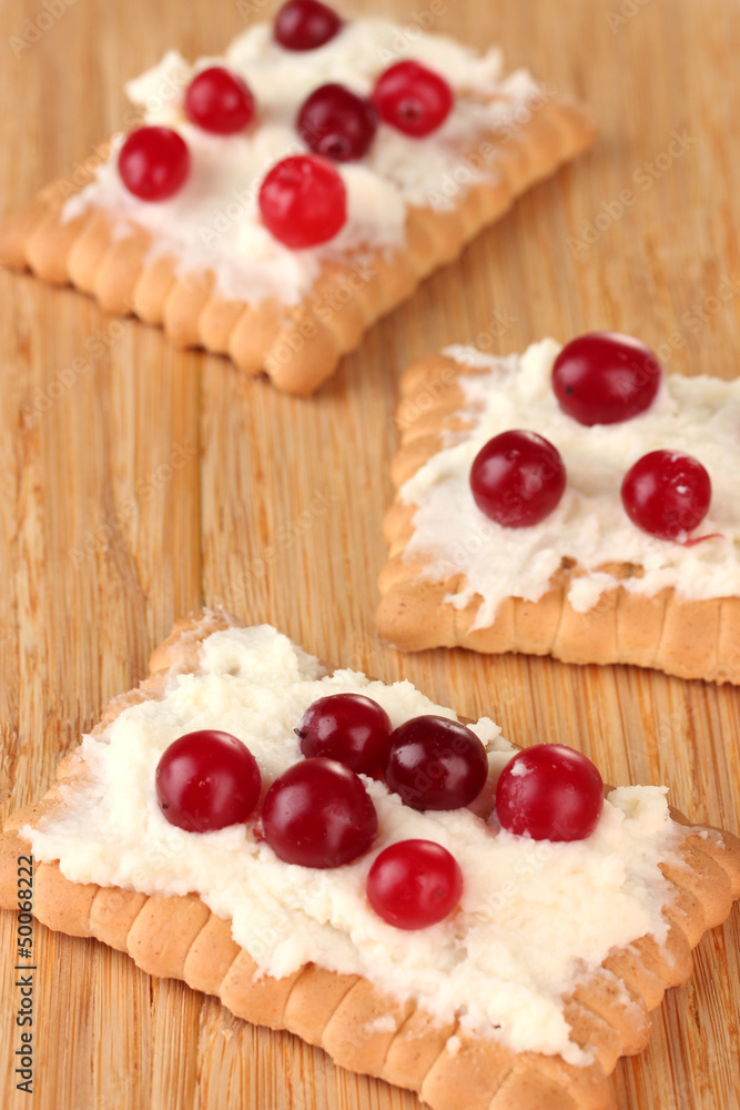 Cookie with cheese and cranberry, on wooden background Cookie with cheese and cranberry, on wooden background