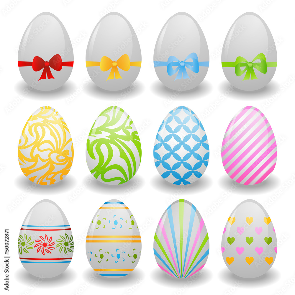 set of white eggs with ribbons and patterns