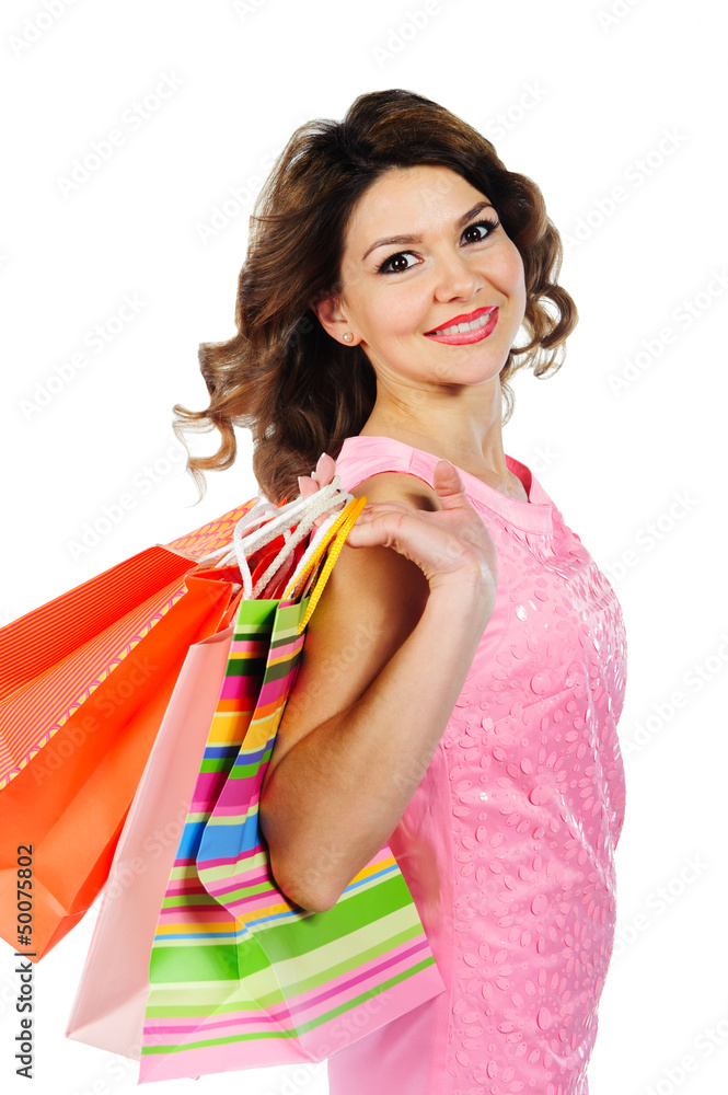 Young cheerful girl with shopping bags isolated on white Young cheerful girl with shopping bags isolated on white