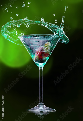 Martini drink over dark bac...