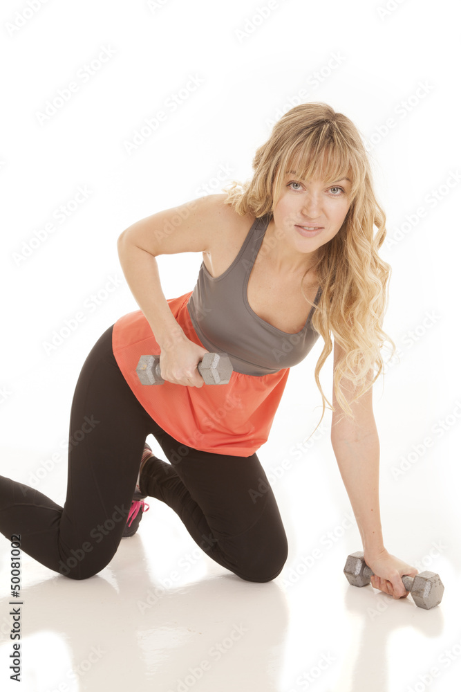 Fototapeta premium woman orange fitness knees weights
