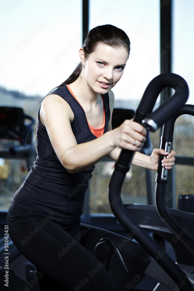 Exercising woman in light Exercising woman in light