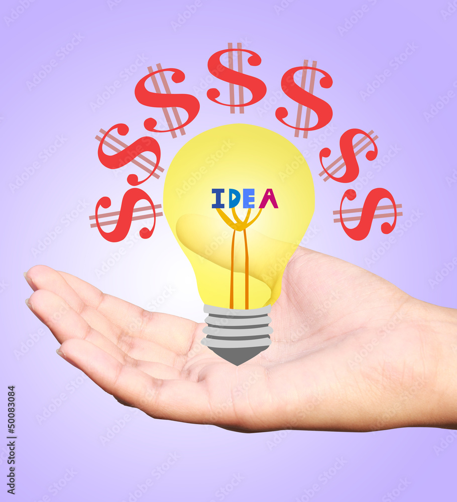 Hand holding an incandescent light bulb isolated on white backgr Hand holding an incandescent light bulb isolated on white backgr