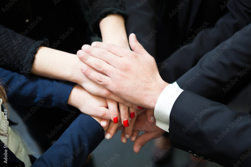 Closeup of pile of hands of business partners Closeup of pile of hands of business partners