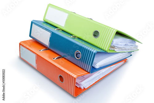 Stationery Office folder on the table with papers. On a white ba photo