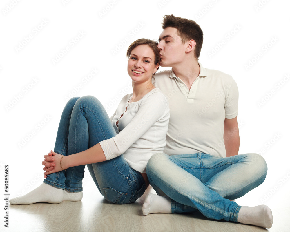 In love young couple, on a white background, in studio In love young couple, on a white background, in studio