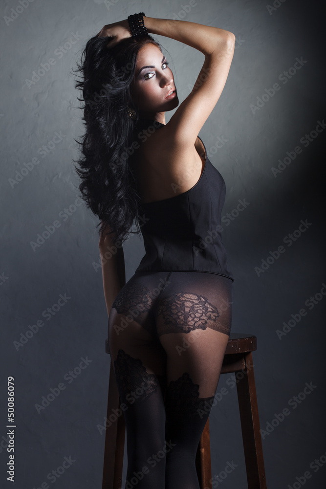 sexy brunette girl in black lingerie and nylon stockings foto de Stock |  Adobe Stock