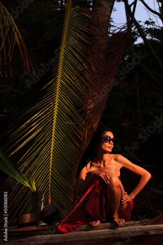 Pretty Asian model on the beach © Netfalls