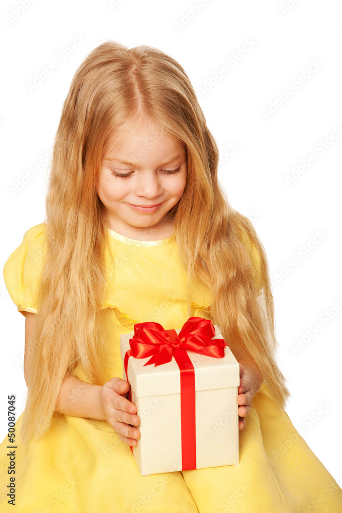 Pretty little girl enjoying gift. Festive concept. Pretty little girl enjoying gift. Festive concept.