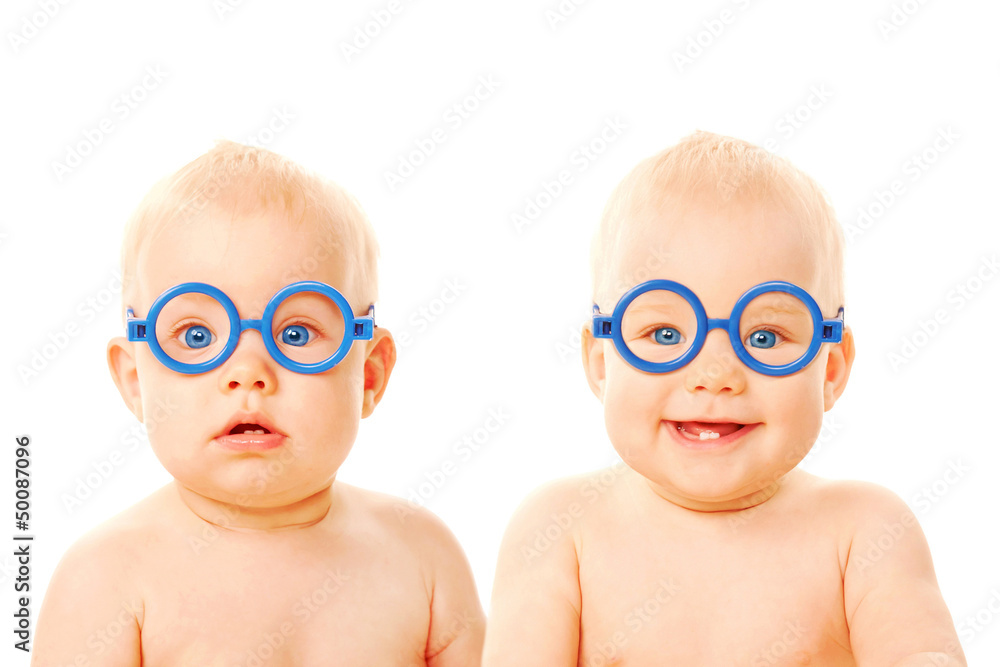Two twins babies boys wearing glasses. - obrazy, fototapety, plakaty 