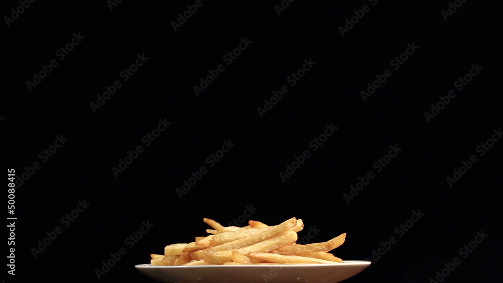 The plate with French fries rotates. Horizontal view The plate with French fries rotates. Horizontal view