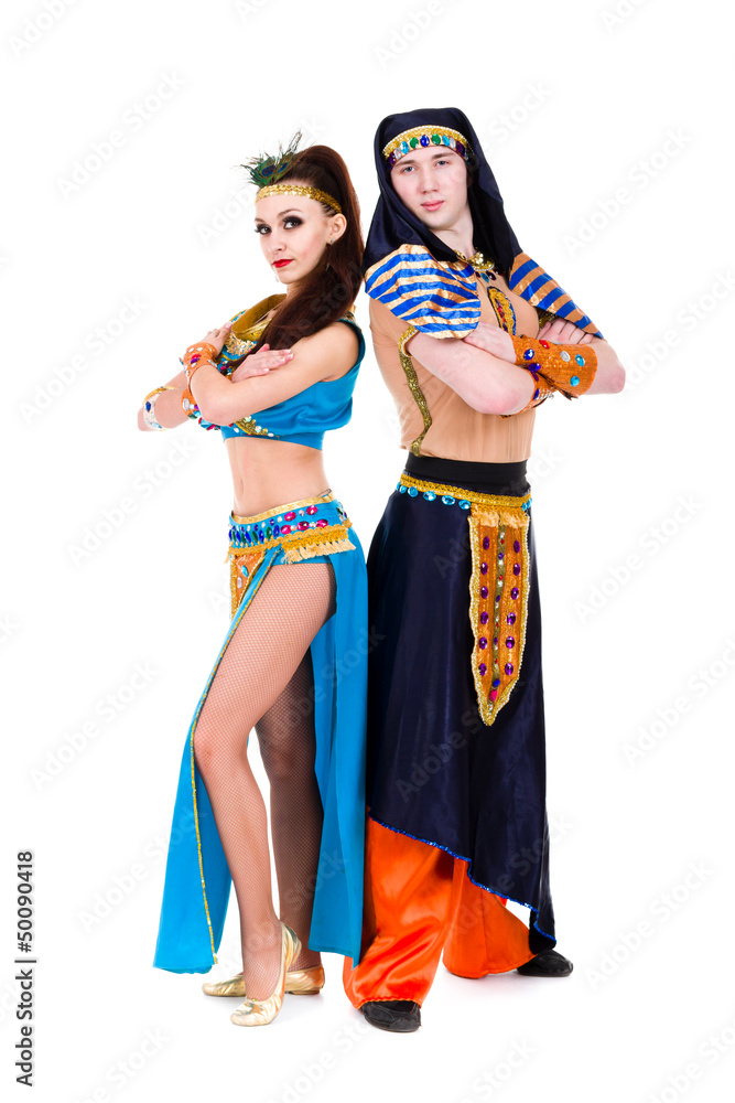 dancers couple dressed in Egyptian costumes posing