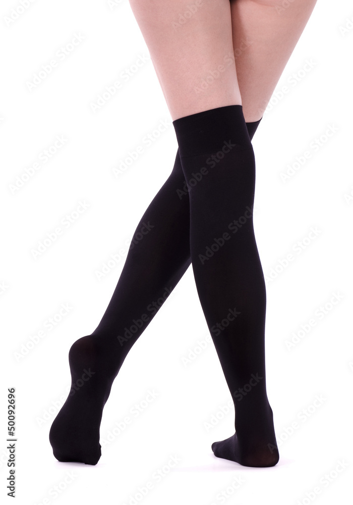 Sexy womanish legs isolated on the white