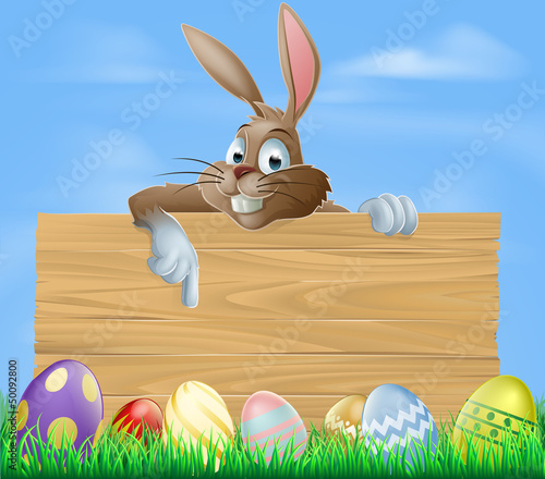 Cartoon Easter bunny pointing