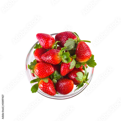 Fresh strawberries in glassy clear bowl