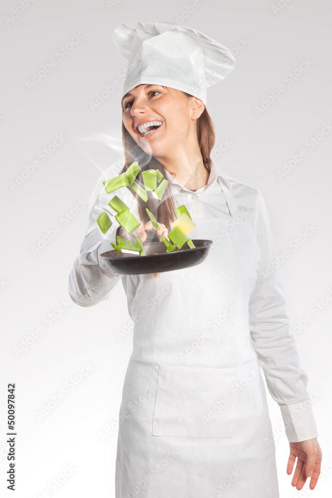 Happy cook woman holding a pan with creative cuisine Happy cook woman holding a pan with creative cuisine