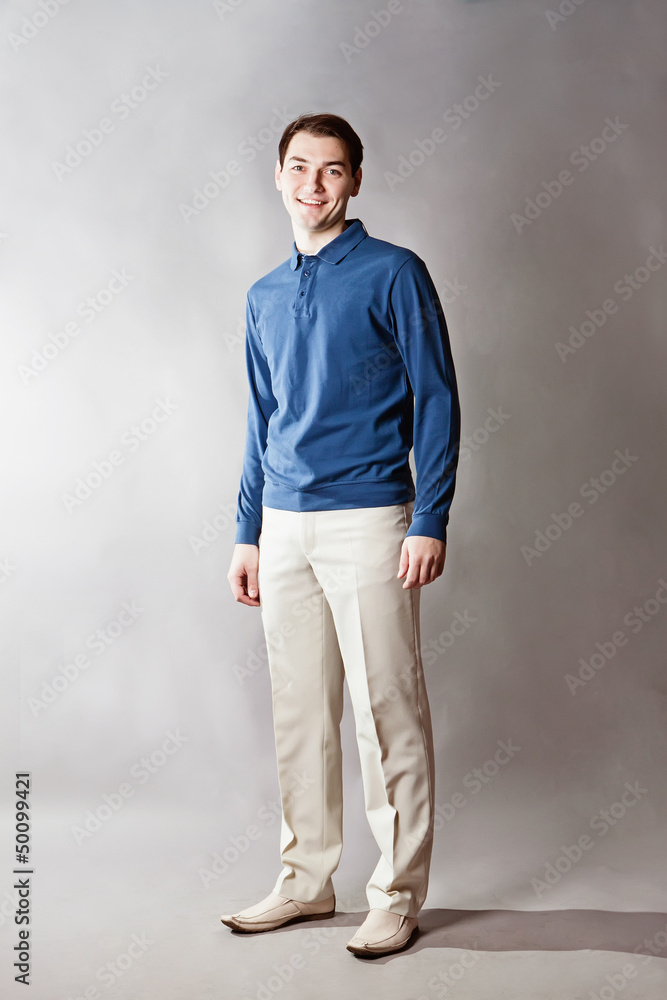 Young handsome man over gray background Young handsome man over gray background