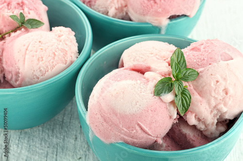 Berry Sorbet. Three bowls of strawberry or raspberry sorbet, garnished with fresh mint.