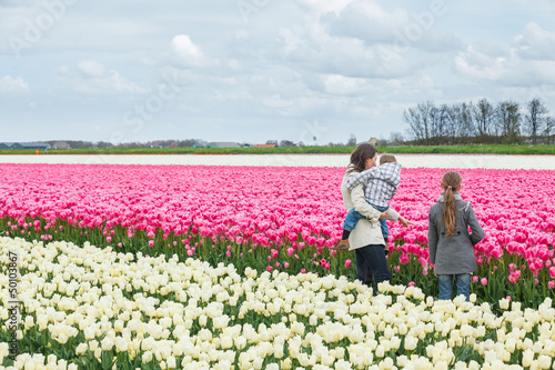 Family and tulips field