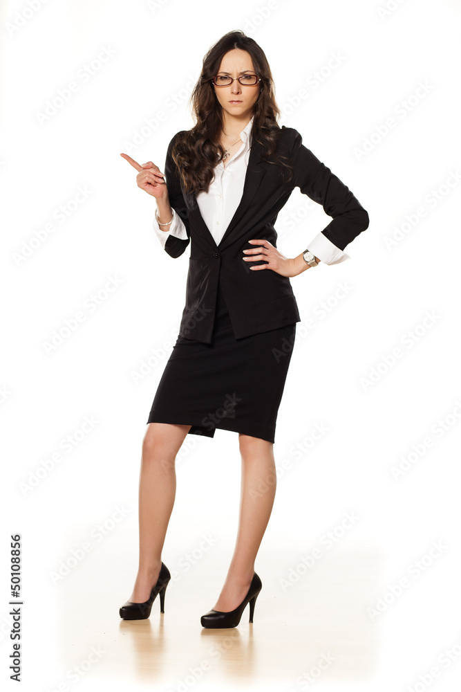 nervous business woman pointing a finger upwards nervous business woman pointing a finger upwards