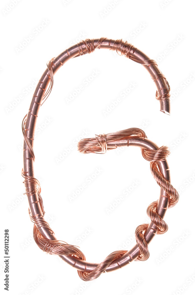 Twisted copper wire in the shape of the letter G Twisted copper wire in the shape of the letter G