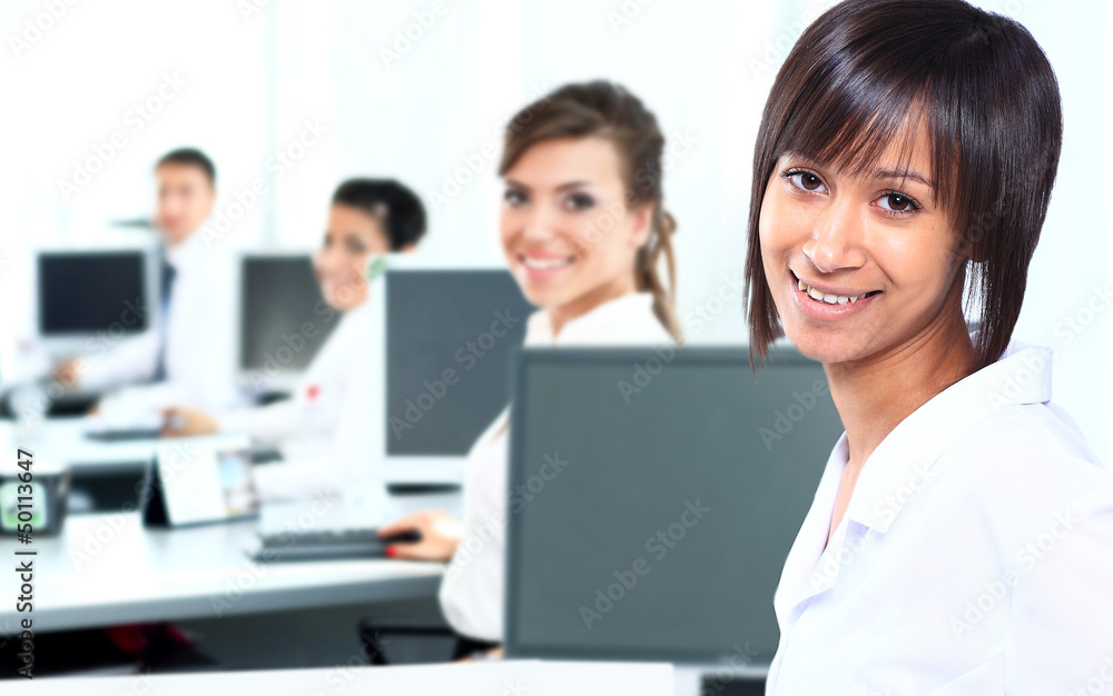 Business woman with a computer at the office Business woman with a computer at the office