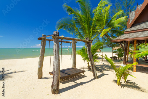 Beautiful tropical beach with coconut palm tree in Thailand