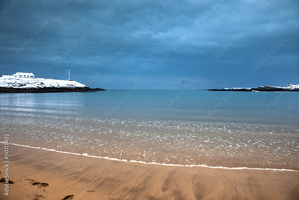 Snow on Trearddur Bay Beach in winter Isle of Anglesey North Wal