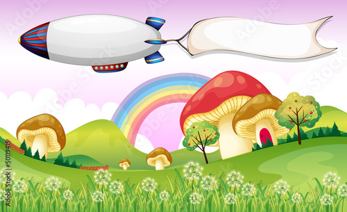 A blimp carrying an empty banner