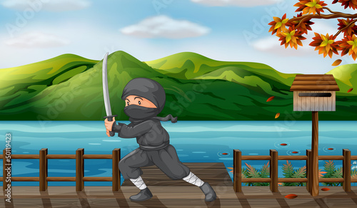 A gray ninja with a sharp sword near the wooden mailbox