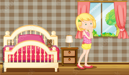 A young girl inside her clean bedroom