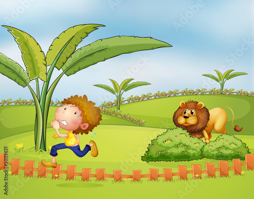 A boy running followed by the lion