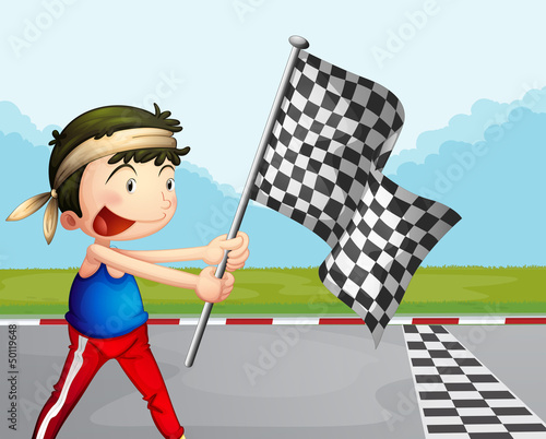 A young boy holding a checkered banner