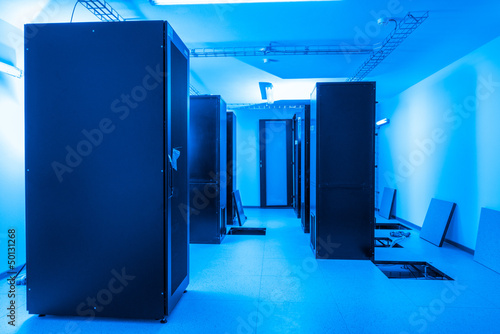 server cabinets inside data center room
