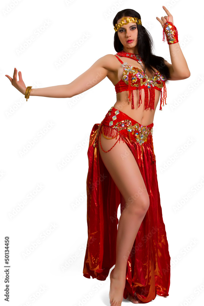 Fototapeta premium girl in a red suit oriental dance in motion isolated on white