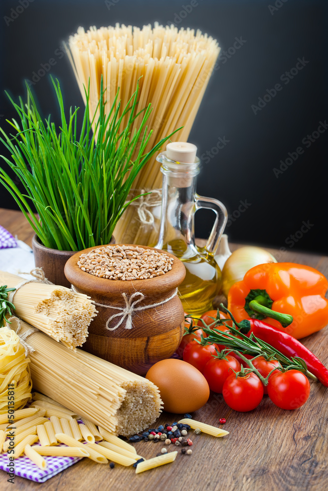The composition of the pasta and vegetables on background The composition of the pasta and vegetables on background