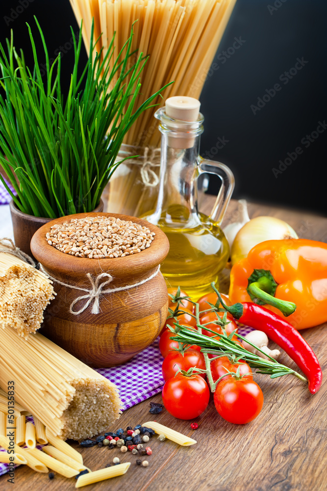 The composition of the pasta and vegetables on background The composition of the pasta and vegetables on background