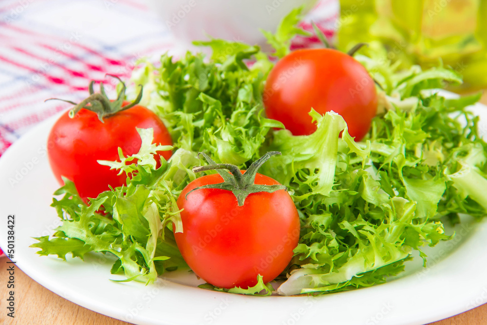 Frizzy crisp lettuce with cherry tomatoes Frizzy crisp lettuce with cherry tomatoes