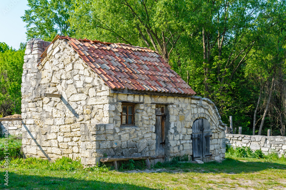 A typical antique Ukrainian country stone house, near Kiev in Ukraine A typical antique Ukrainian country stone house, near Kiev in Ukraine