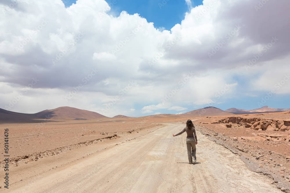 Girl catches the car on a deserted road Girl catches the car on a deserted road