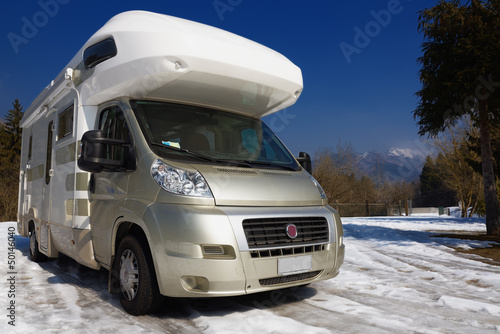 Camper parked on snow in the mountain